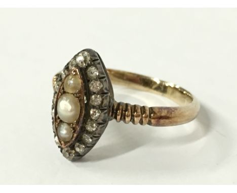 A Victorian gold, silver, diamond and pearl ring (size M).
(R1)