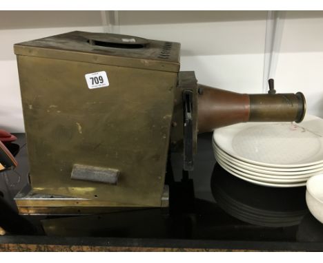 A Victorian brass slide projector.