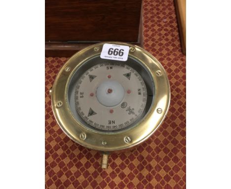 A brass ship's compass.
