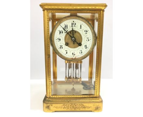 A 19th century Maple & Co., Paris gilt brass and glass cased mantle clock with visible mercury pendulum, white china dial wit