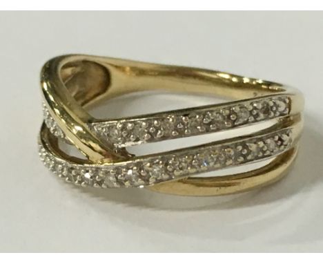 A 9 carat gold double diamond row twist ring (size P).
(R17)