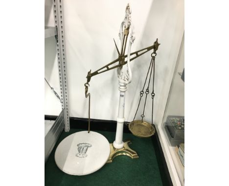 A set of 19th century brass balance scales with ceramic dish (af).