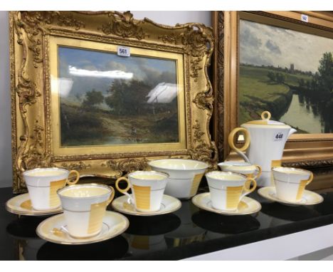 A Shelley china Regent Art Deco coffee set supplied by Lawleys, Regent Street decorated in a yellow and gilt pattern comprisi