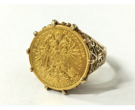 A 1912 gold half Sovereign Signet ring in pierced 9 carat gold mount.