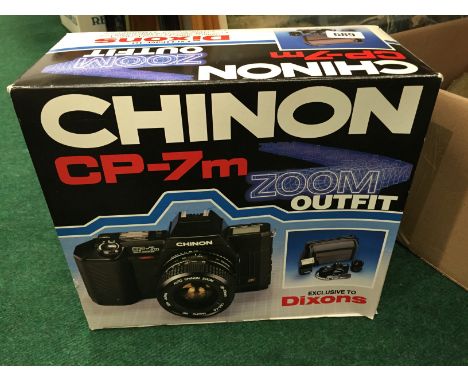 A Chinon CP-7M zoom camera (not checked).