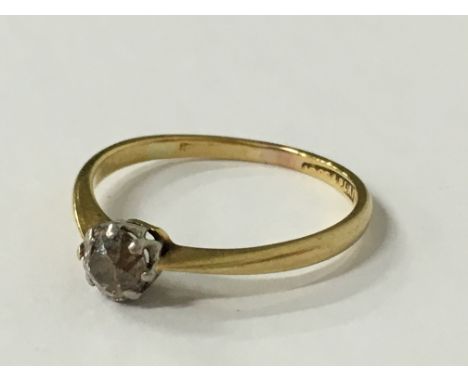 An 18 carat gold and platinum cinnamon diamond solitaire ring (approx. 0.25 carat), (size M).