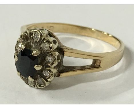 A 9 carat gold sapphire and diamond set ring (size M 1/2).
(R13)