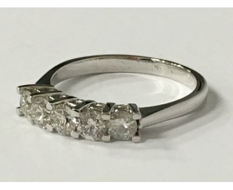 An 18 carat gold five stone diamond ring (1 carat TDW), (size R).
(R2A)