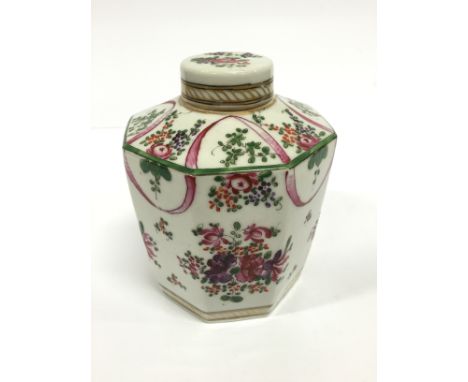 A 19th century French Samson porcelain tea caddy decorated in the Famille Rose style with bouquets of flowers and garlands.