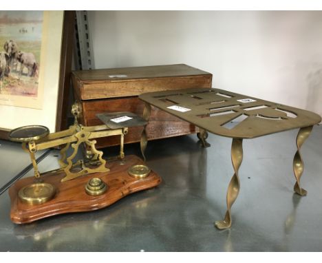 A set of early 20th century brass postal scales and weights together with a 19th century mahogany tea caddy with fitted inter