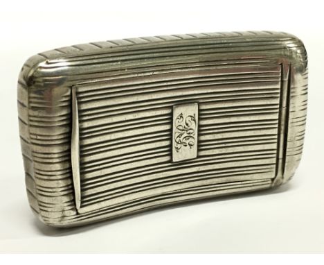 A Georgian curved silver snuff box with engraved lineal decoration and gilt interior.