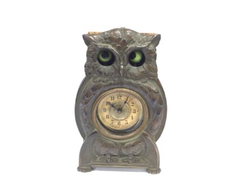 An early 20th century Arts & Crafts copper and wood cased mantle clock modelled as an Owl with moving eyes (not working).