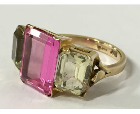 A 9 carat gold pink and yellow stone ring (size M).