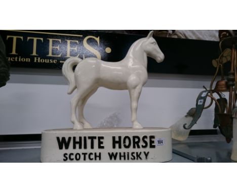A large early 20th century plaster White Horse Scotch Whisky pub advertising model.