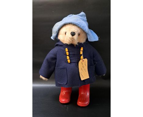 PADDINGTON BEAR BY GABRIELLE DESIGNSwith red wellington boots, blue duffle coat and light blue hat, 46cm high 