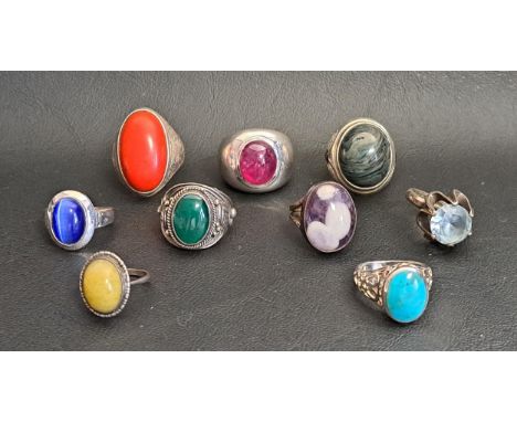 GOOD SELECTION OF NINE SILVER RINGSincluding larger dress rings, with examples set with cabochon ruby, blue topaz, turquoise 