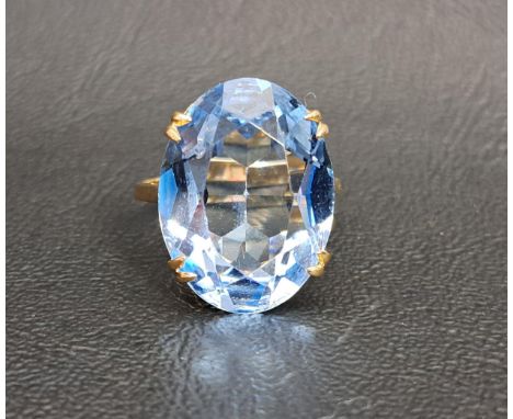 LARGE BLUE TOPAZ SINGLE STONE COCKTAIL RINGthe topaz measuring 19.5mm x 14.2mm x 8.5mm, on nine carat gold shank, ring size K