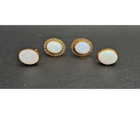 TWO PAIRS OF OVAL OPAL STUD EARRINGSone pair in eighteen carat gold, the opals measuring approximately 9.4mm x 7.6mm; the oth