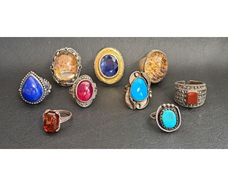 GOOD SELECTION OF NINE SILVER RINGSincluding larger dress rings, with examples set with sapphire, ruby, amber, lapis lazuli, 