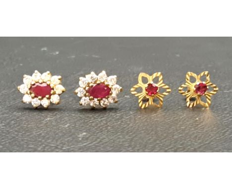 TWO PAIRS OF RUBY SET EARRINGScomprising a pair of ruby and CZ cluster stud earrings and a pair of flower design earrings wit