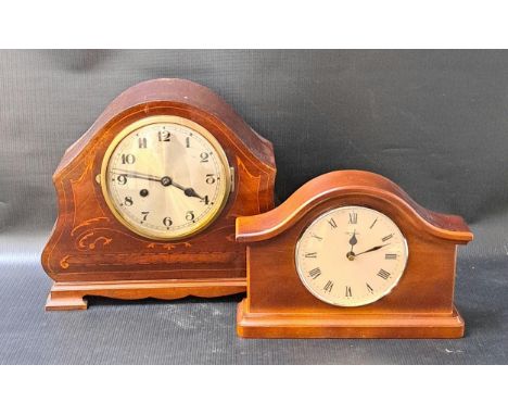 EDWARDIAN MAHOGANY AND INLAID MANTLE CLOCKwith a shaped case and a circular silvered dial with Arabic numerals and an eight d