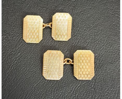 PAIR OF NINE CARAT GOLD CUFFLINKSwith engine turned decoration, total weight approximately 5.3 grams, in fitted box 