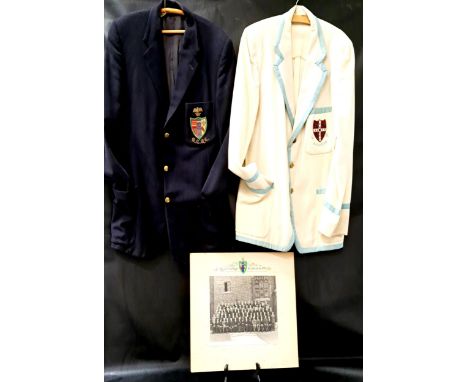 TWO 1950s CAMBRIDGE BLAZERSone in navy blue with Queen's College crest, the other in cream with light blue trim and with the 
