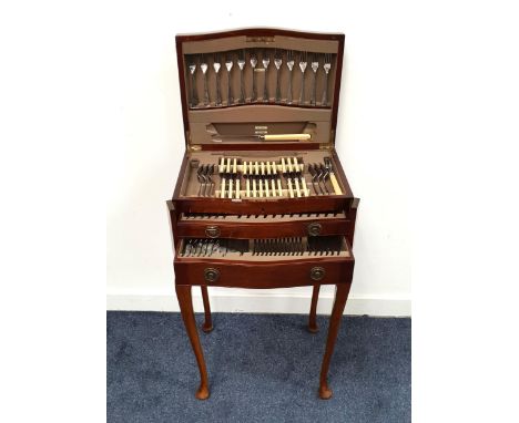 MAHOGANY TABLE CANTEEN OF CUTLERYthe inlaid mahogany canteen with lift up lid and two drawers containing a twelve place setti