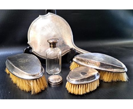 VARIOUS SILVER DRESSING TABLE ACCESSORIES1920s marks, comprising two brushes, hand mirror, silver topped bottle, and another 