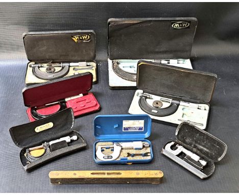 SEVEN VINTAGE BOXED MICROMETERSof various sizes, most with small spanners/accessories; together with a vintage brass mounted 