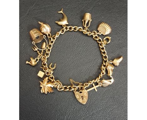 NINE CARAT GOLD CHARM BRACELETwith heart padlock clasp and various charms including gardening tools, a maple leaf and a teapo