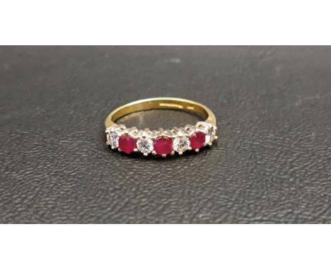 RUBY AND DIAMOND SEVEN STONE RINGthe four diamonds totalling approximately 0.35cts and the three rubies also totalling approx