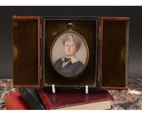 A late 19th century oval portrait miniature on ivory, lady with blue dress and white lace collar with blue bow, casedIvory Su