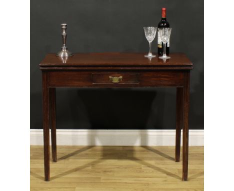 A George III mahogany card table, hinged top with moulded edge enclosing a baize lined playing surface, above a single frieze