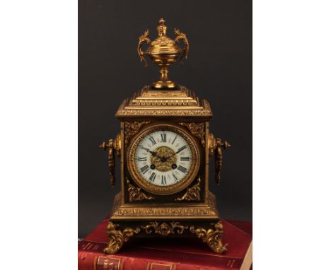 A 19th century French gilt brass table clock, 10.5cm dial inscribed with Roman numerals, twin winding holes, eight day moveme