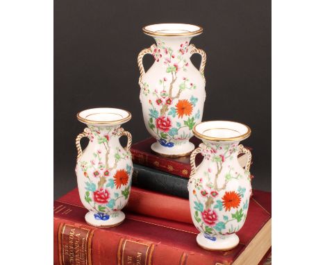 An English porcelain garniture, of two-handled ovoid vases, probably Spode, painted in the Chinese famille rose manner, rope 