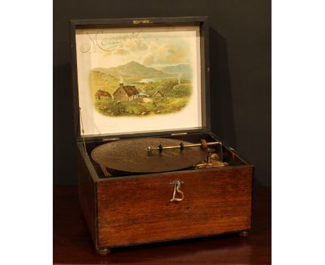 A late 19th century symphonion, horizontal mechanism playing 25cm discs, hinged cover, cranking handle to side, 32.5cm wide, 