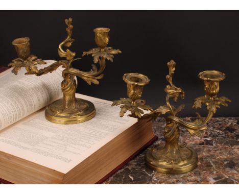 A pair of 19th century gilt brass two-light candelabra, cast with scrolling acanthus, 21cm high, c.1880 