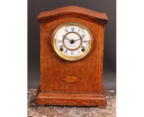 An early 20th century oak mantel clock, 10cm circular dial inscribed MANUFACTURED BY SEIKOSHA, TOKYO, JAPAN., Roman numerals,