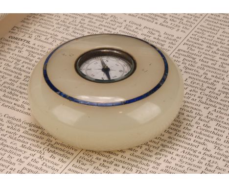 An Art Deco period onyx and lapis lazuli compass desk weight, 8cm diam, c.1920 