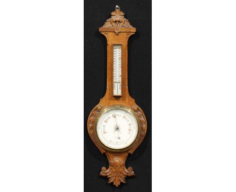 A late Victorian/Edwardian Essex oak wheel barometer, 18.5cm circular register inscribed R.A. JONES & SONS. SOUTHEND-ON-SEA.,