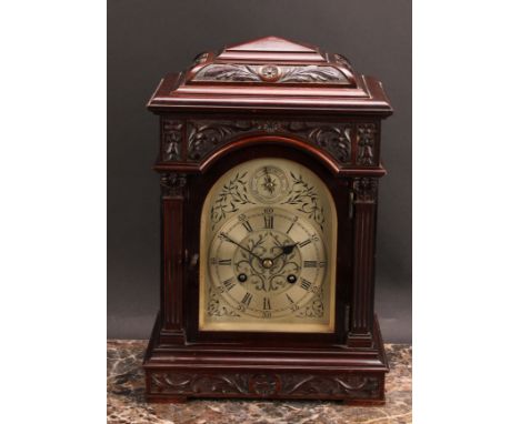 An early 20th century mahogany bracket-form mantel clock, 14cm arched silvered dial, Roman and subsidiary Arabic numerals, tw