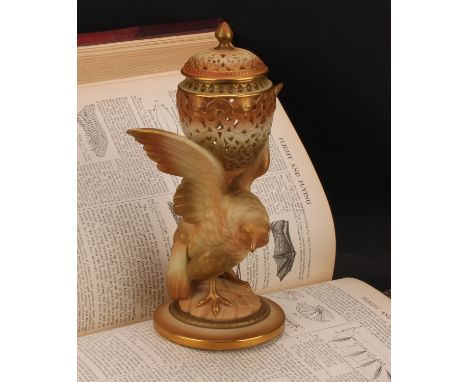 A Royal Worcester pot pourri and cover, the reticulated ovoid pot and cover supported between the wings of a bird of prey, gi