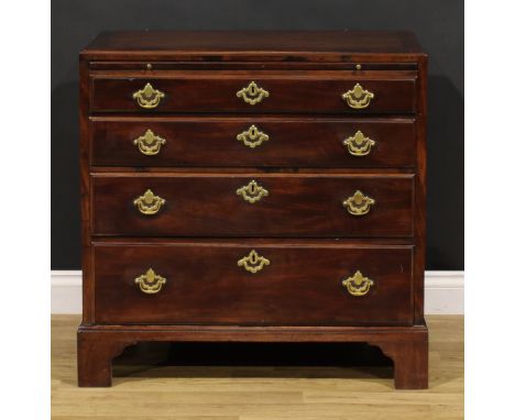 A George II mahogany caddy top bachelor’s chest, crossbanded top above a slide and four long graduated drawers, brass swing h
