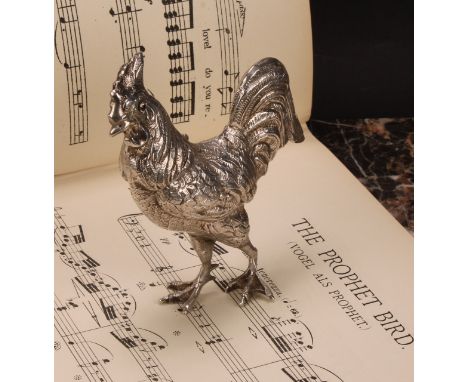 A Continental silver novelty spice canister, as a cockerel, hinged cover, ruby eyes, 12cm high, early 20th century 