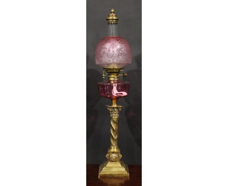 A 19th century brass oil lamp, Maple London, cranberry glass font, Hinks Patent twin burner, ovoid frosted graduated cranberr