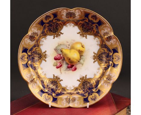 A Royal Worcester shaped circular dish, painted by Ricketts, signed, with ripening fruit within fancy gilt cartouche, the bor