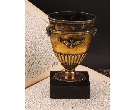 A French silver gilt vase, in the Empire taste, applied with masks and neoclassical motifs, black marble base, 13.5cm high ov