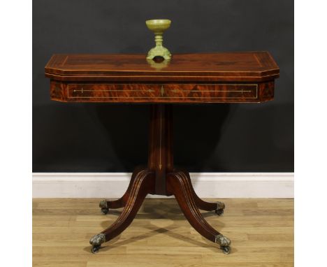 A Regency mahogany and brass marquetry card table, hinged top enclosing a baize lined playing surface, octagonal column, sabr