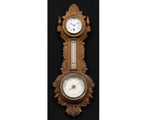 A late Victorian/Edwardian oak wheel weather station timepiece, 8cm circular clock dial inscribed with Roman numerals, above 